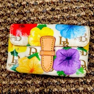 Dooney and Burke women’s floral wallet w.back pocket and key hook.